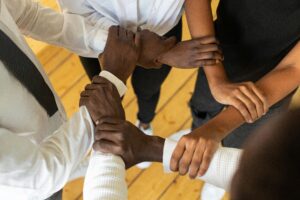 Close up of People Holding Arms